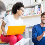 Step-by-step guide on how do I set up a scholarship fund: professionals collaborating on legal documents and funding strategies.