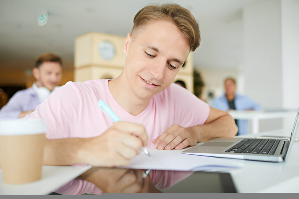 Student diligently writing their abbott and fenner scholarship application essay for financial aid.