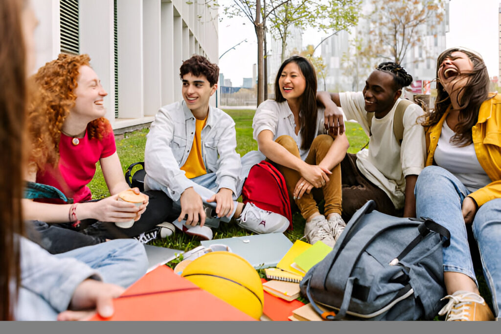 Diverse group of college students celebrating educational success, benefiting from opportunities like the Golden Door Scholarship.