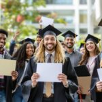 Diverse college students celebrating merit based scholarships and academic achievement with certificates on university campus
